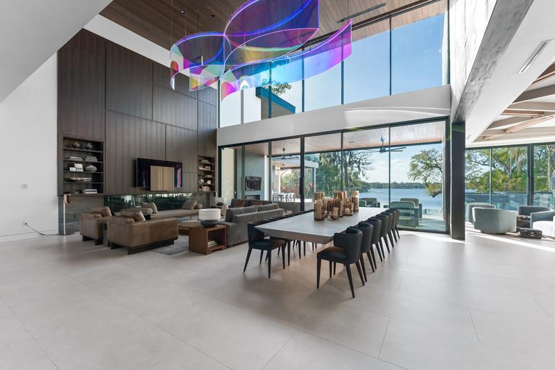 Great room and dining space with lake views — The New American Home 2026, Orlando FL