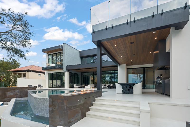 Rear exterior with spa and cascading steps — The New American Home 2026, Orlando FL