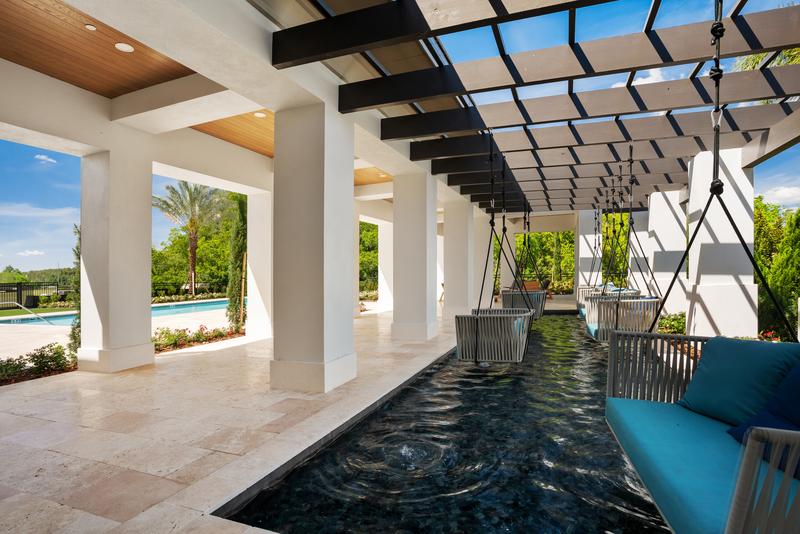 Amenity garden pergola with swings over the water feature — Ritz-Carlton Residences at Grande Lakes, Orlando FL