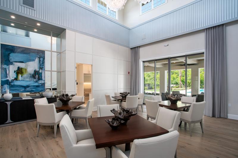 Dining room with views to the pool deck — Ritz-Carlton Residences at Grande Lakes, Orlando FL