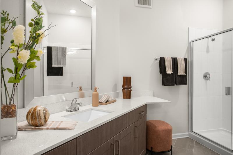 Model unit bathroom with walk-in shower — Sanctuary at Daytona apartments, Daytona Beach FL